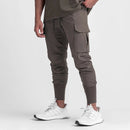 Calça desportiva camuflada para homem – leve, elástica e de secagem rápida.