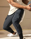 Calça desportiva camuflada para homem – leve, elástica e de secagem rápida.