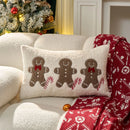 Capa de almofada de Natal bordada com os dizeres “HOHOHO” e desenho de boneco de gengibre.