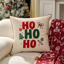 Capa de almofada de Natal bordada com os dizeres “HOHOHO” e desenho de boneco de gengibre.